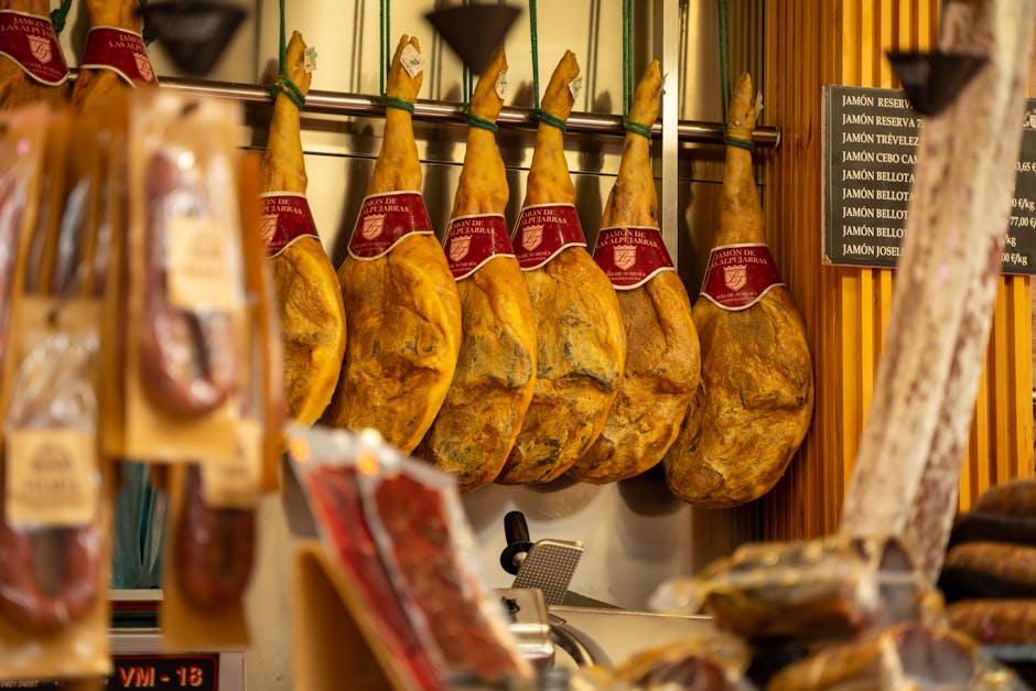 Close-up of Spanish jamón hanging in a butcher shop in Valencia, Spain.